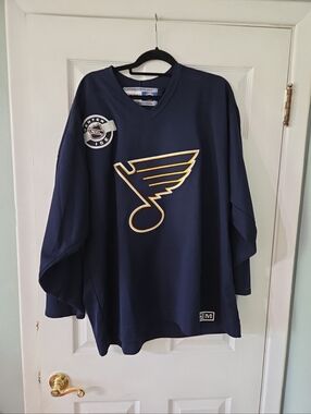 CCM Navy and Gold Center Ice Hockey Jersey with Team Crest. Size XL.